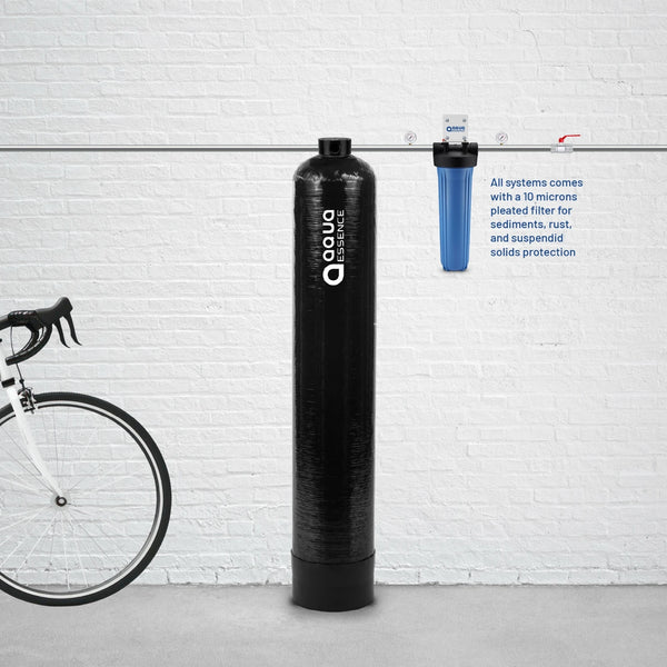 Water filter system with 'Aqua Essence' branding against a white brick wall, next to a bicycle.
